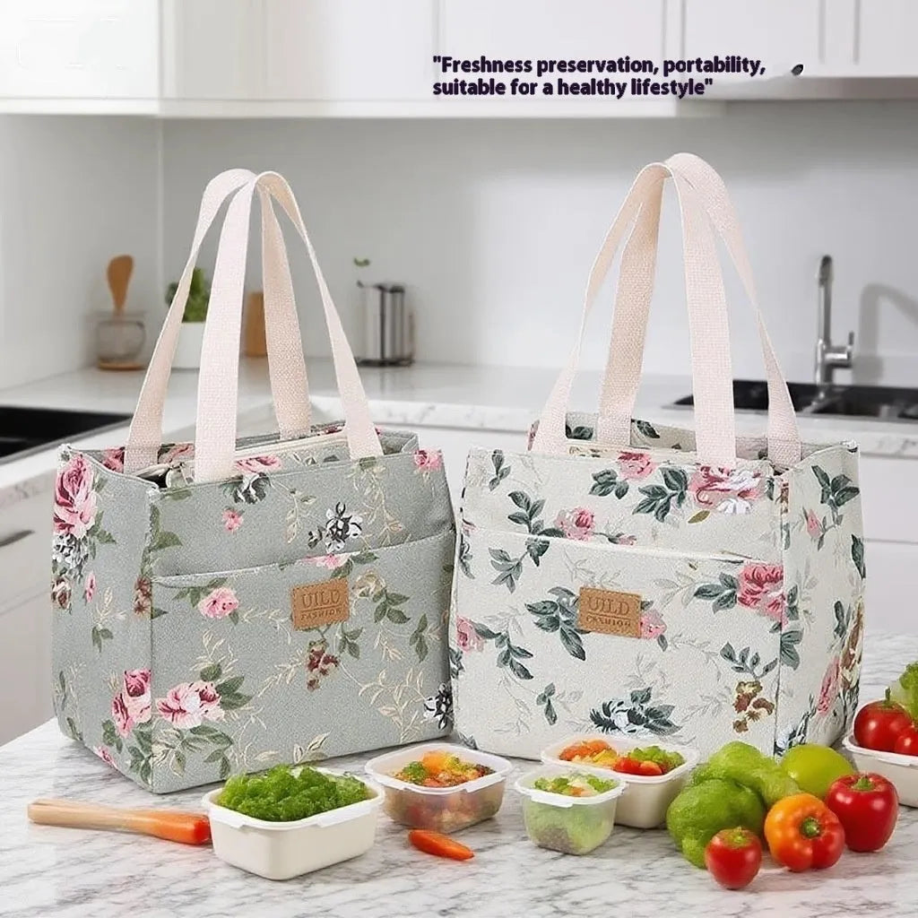 Women's printed floral canvas tote bag with aluminium frame open, showing large interior.