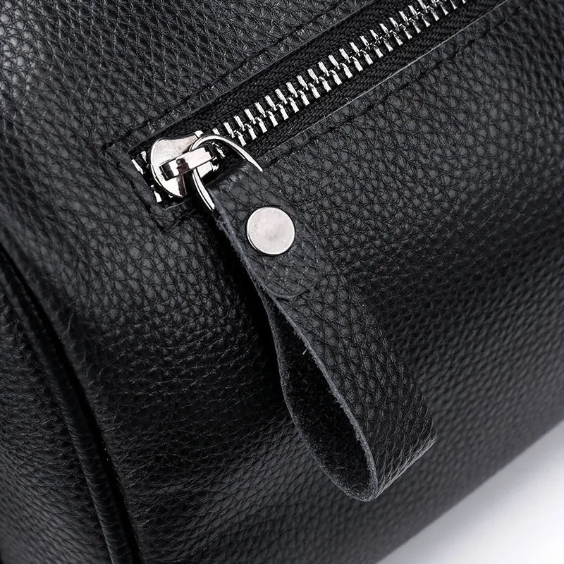 Black genuine leather crossbody bag showing 24x16x13cm dimensions with one-shoulder strap