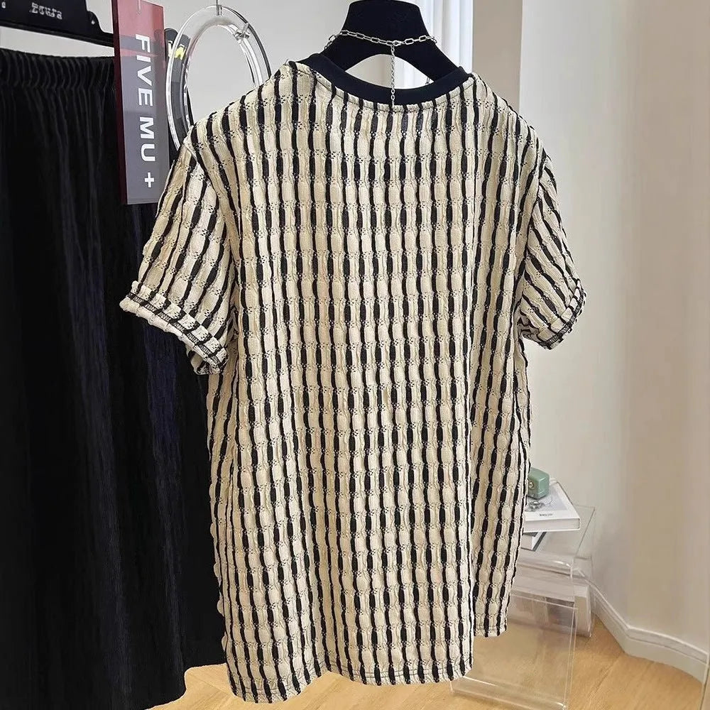 Men's black striped linen silk blend short sleeve shirt laid flat showing loose casual fit