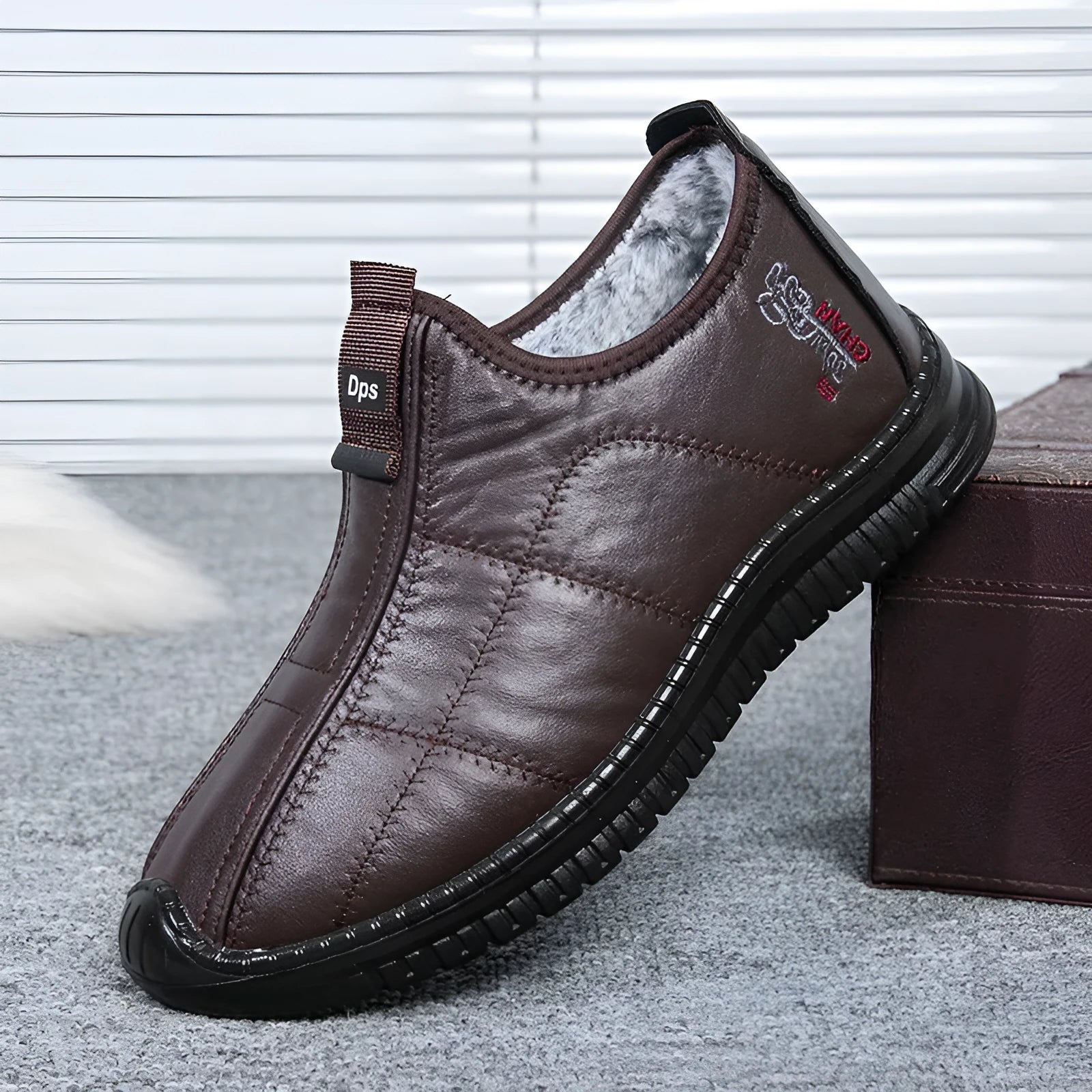 Men's brown buckle-up winter boots with a cotton upper and thick sole on a white background.