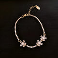 Gold-coloured copper women's bracelet with geometric design and zircon inlay