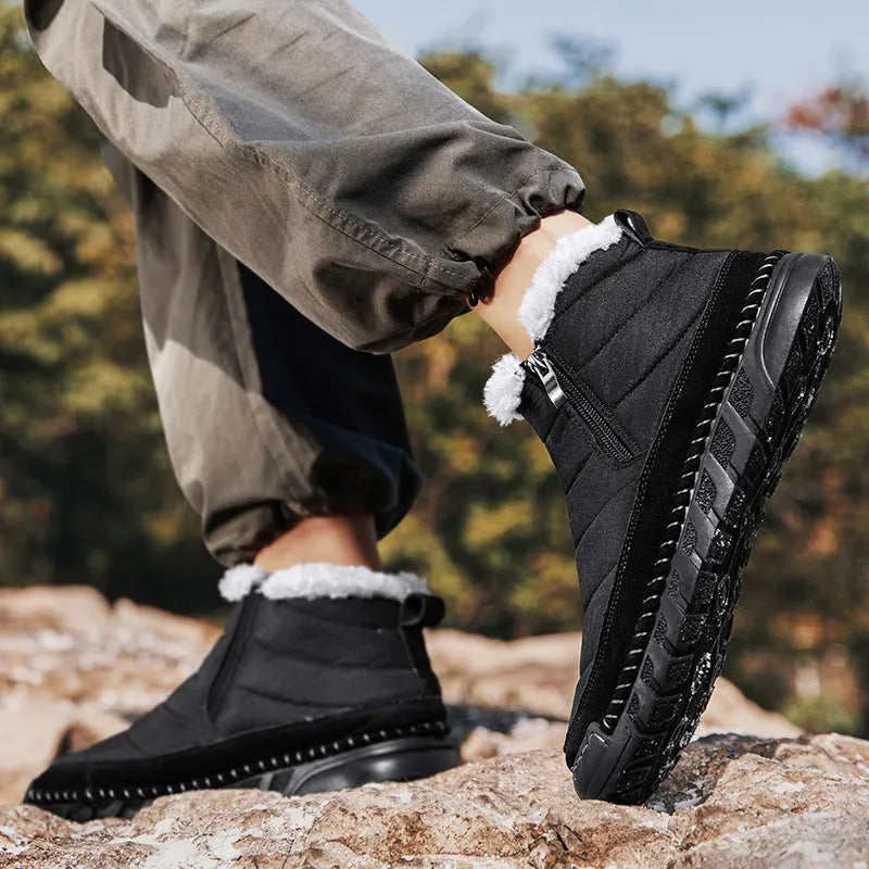 Men's plus size snow boot in black with round toe, cotton upper, and rubber sole.