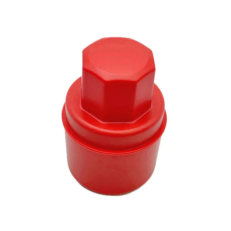Black car tyre polishing sponge brush with a red lid, showing its size next to a car tyre.