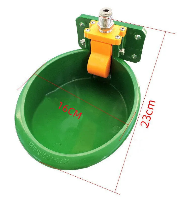 Green plastic automatic drinking bowl for sheep and pigs on farms