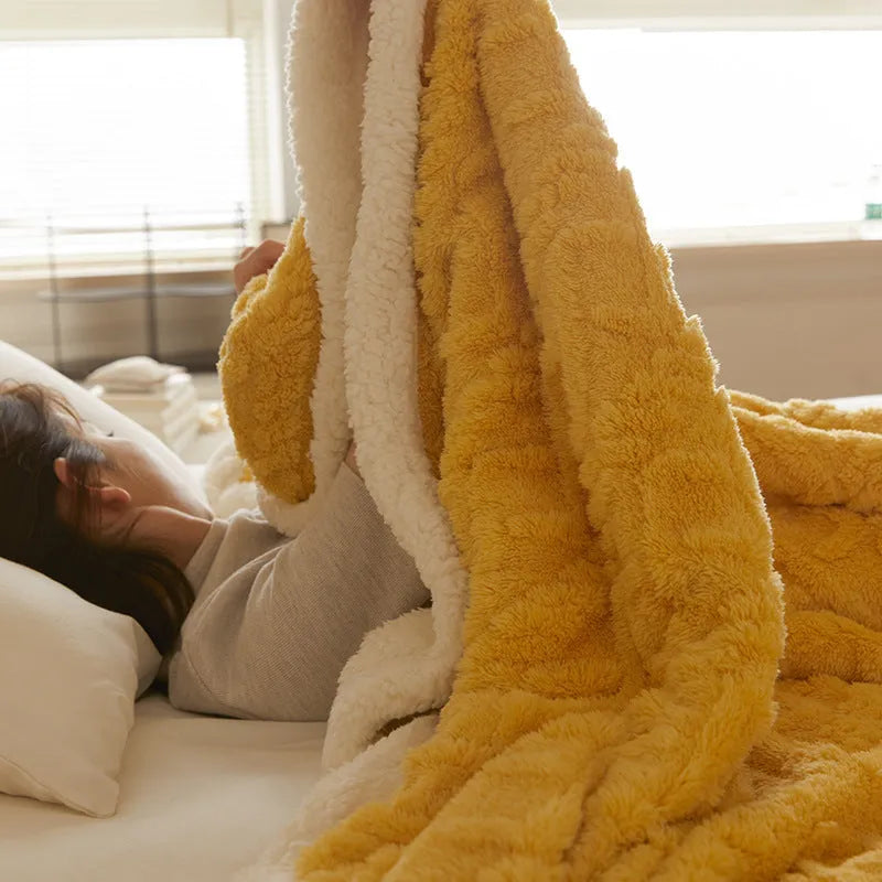 Polyester winter thermal flannel blanket in beige, laid flat showing its texture and simple modern style.