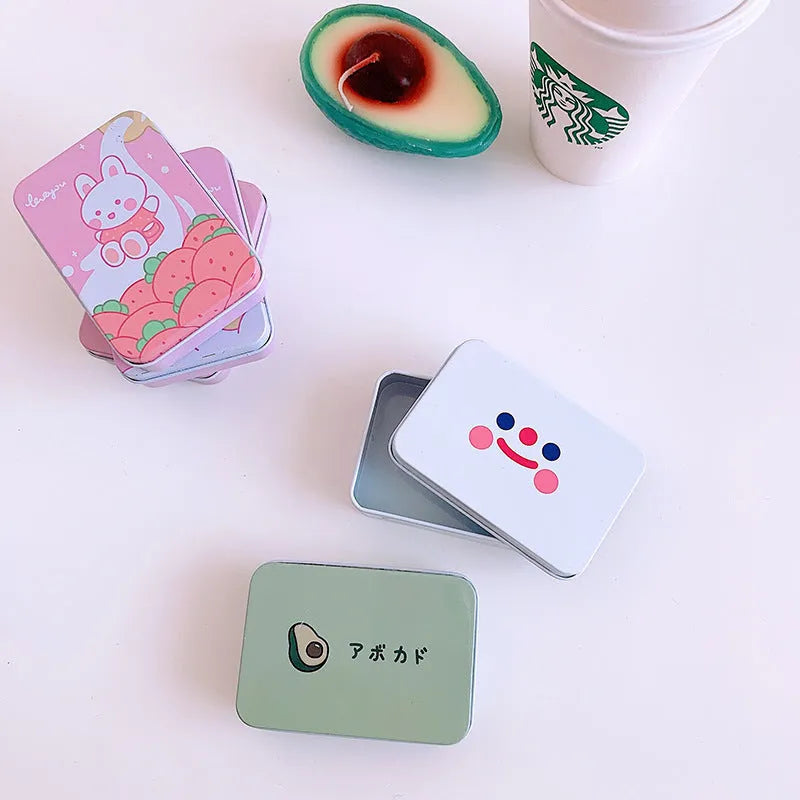 Iron storage tin box 9.5cm with white smiley face design on green background