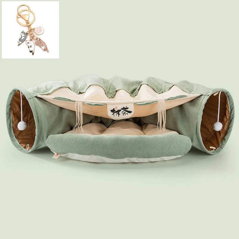 Collapsible cloth cat tunnel in Pink colour with visible opening, measuring 45x50x22 cm, on wooden floor