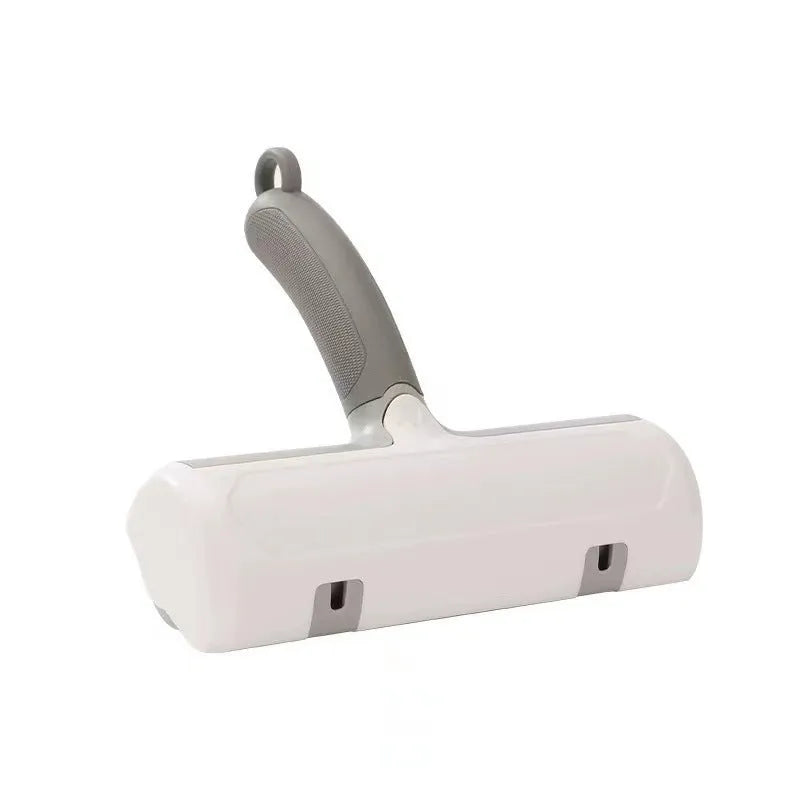 Mint green and twilight grey cat hair removal brush with two head style options on a white background.