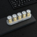 RGB LED digital tube clock displaying time with colourful lighting effects on desk