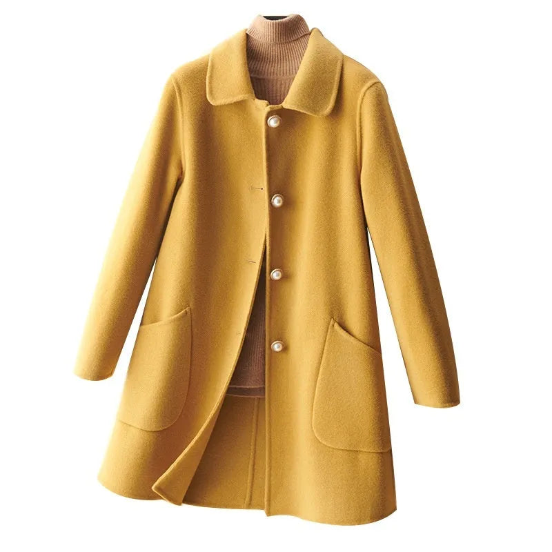 Women's solid colour wool coat with a doll collar and pearl buckle, shown in a mid-length cut.