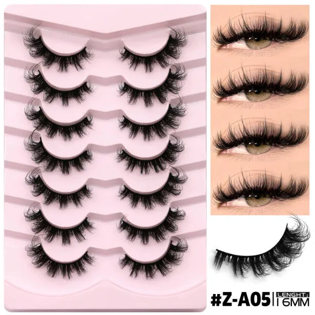 Box of natural false eyelashes with thick artificial fibre lashes and included glue tube