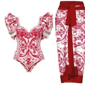 Women's floral printed one-piece polyester swimsuit on a hanger, showing skirted style.