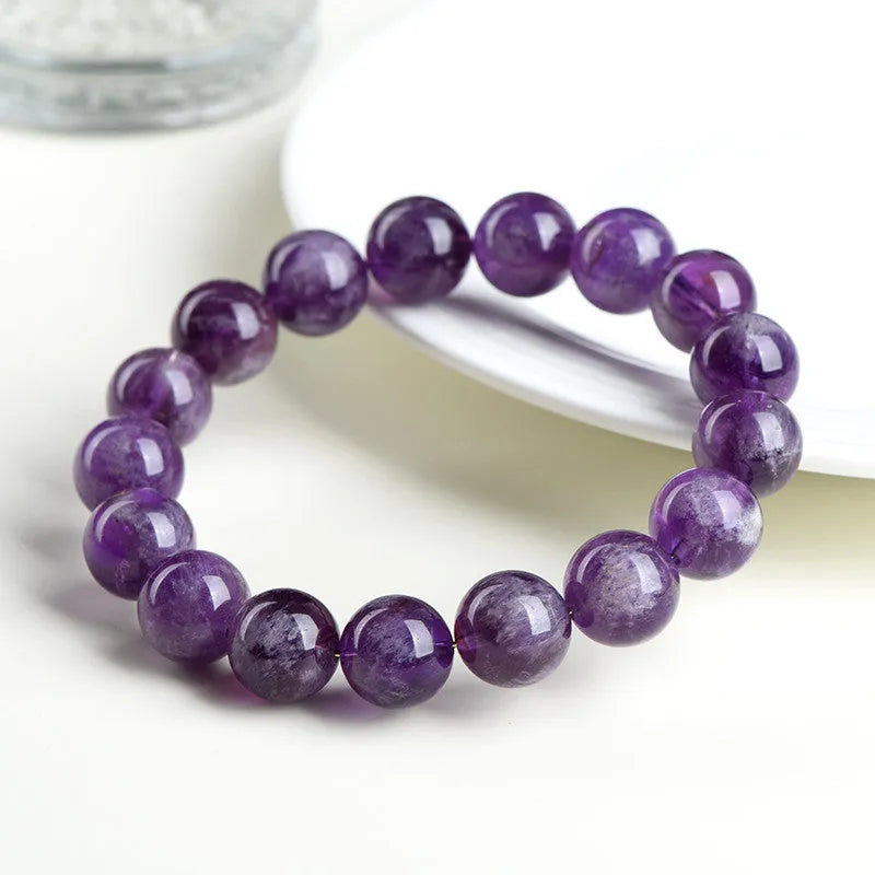 Natural feather amethyst crystal bracelet in snow mountain purple colour with scattered beads.
