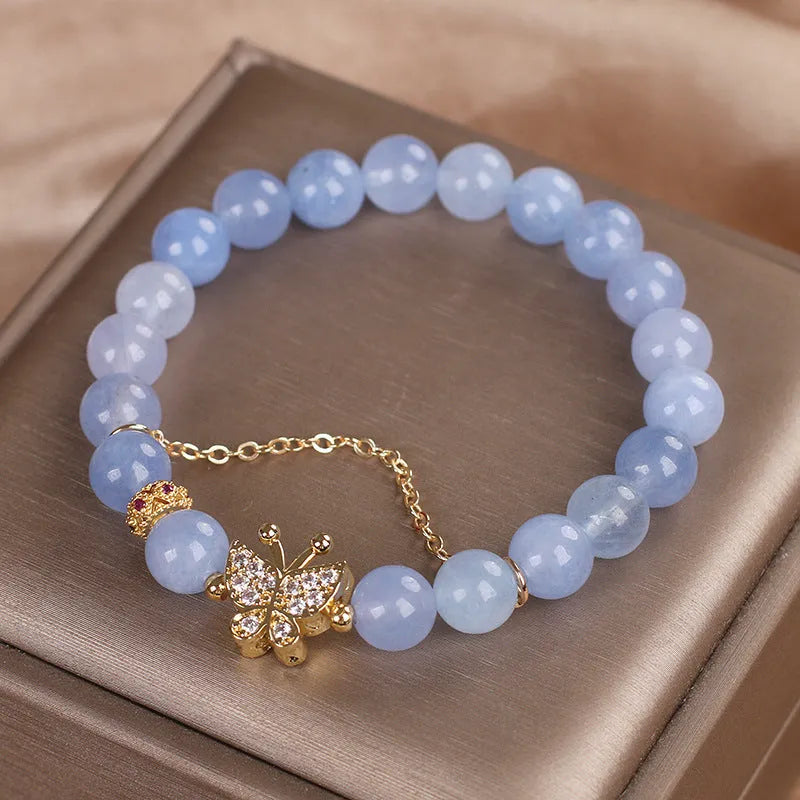 Sky blue butterfly crystal bracelet for women with pearls, rhinestones, and sequins on a 17cm chain.