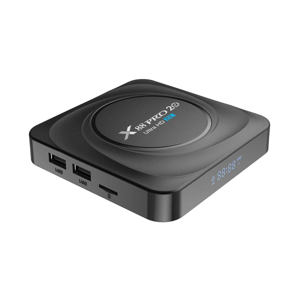 Black Android TV set-top box with HDMI port, shown with remote control and UK plug power adapter.