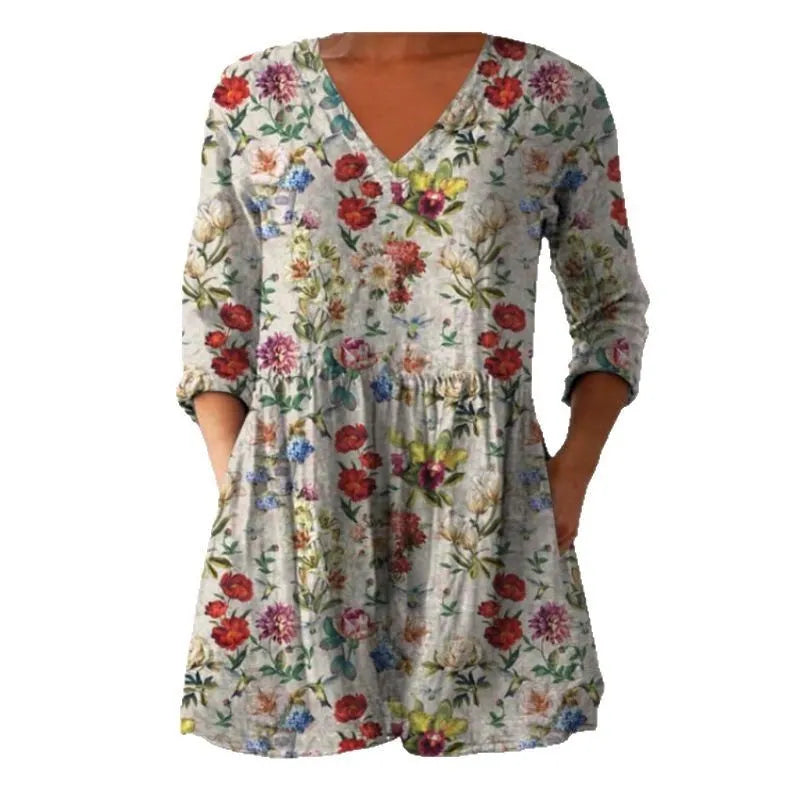 Women's loose fit printed dress with wide waist and three-quarter length sleeves.