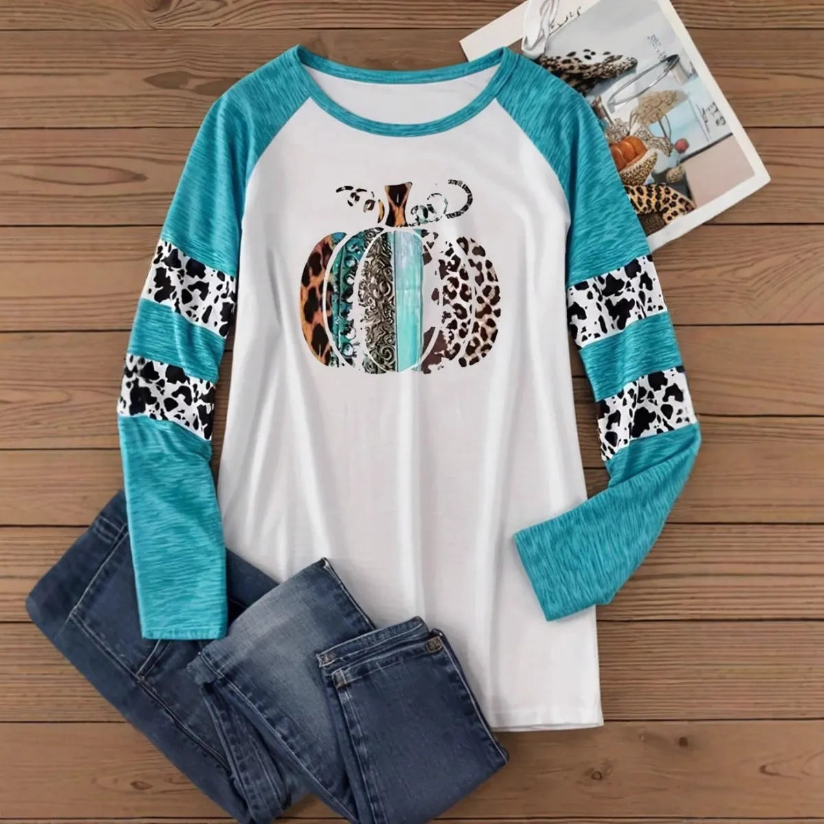 Sky blue long sleeve t-shirt with a detailed 3D digital print of a Halloween pumpkin.