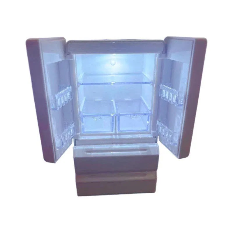 Small white illuminated candy toy model for dollhouse display, shown with light on.