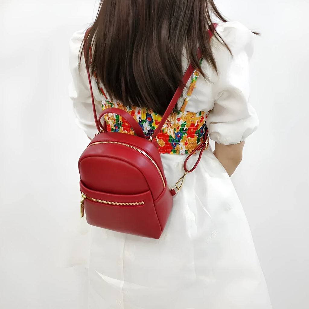 Soft PU mini backpack in street trend style with contrast colour detailing and external pocket.