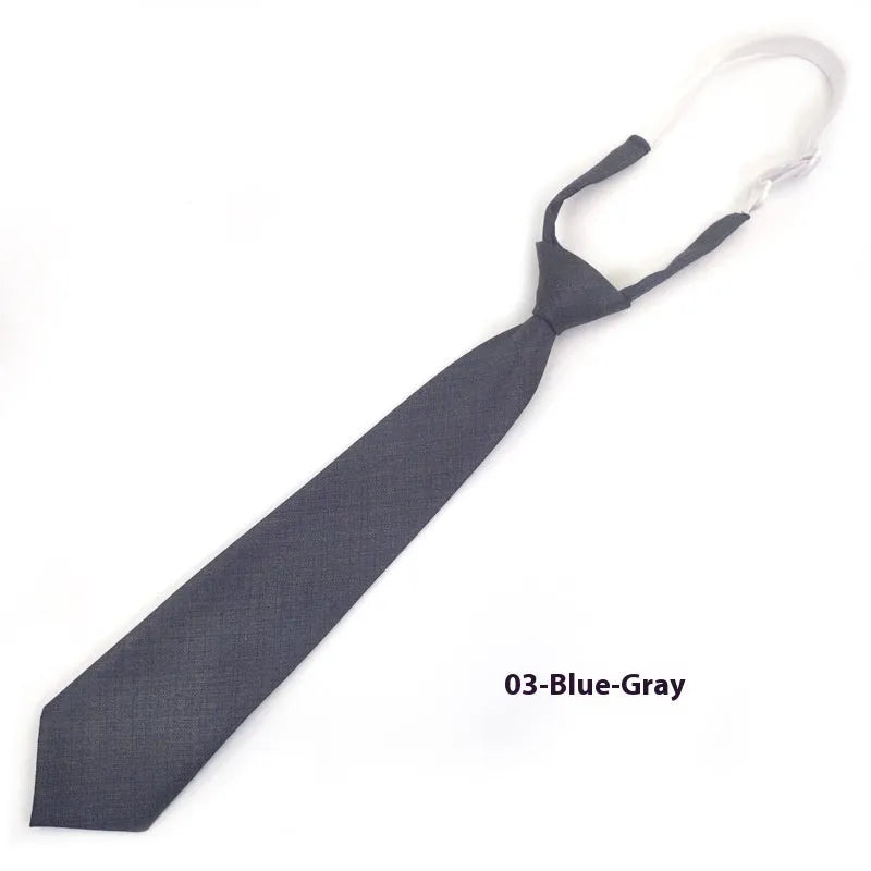 A navy blue cotton men's bow tie with an arrow style design on a white background.