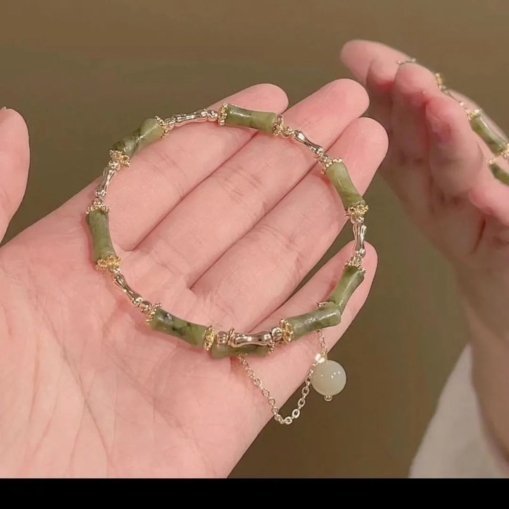 Women's bamboo beaded bracelet with coloured glaze beads and bamboo joints in plum wine colour