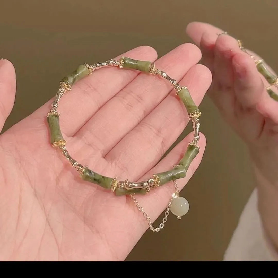 Women's bamboo beaded bracelet with coloured glaze beads and bamboo joints in plum wine colour