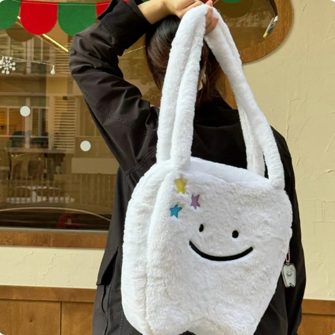 White plush large tooth design shoulder tote bag with crossbody strap and zipper opening