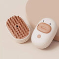 White rechargeable pet steam brush with water tank for cat and dog grooming