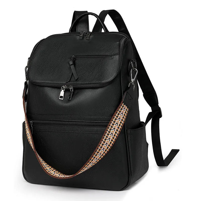 Retro solid colour PU backpack with curved shoulder straps shown in black.