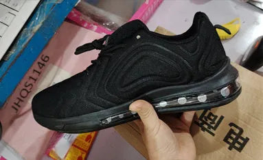 Men's black lace-up sneakers with a thick sole and round toe for outdoor sports.