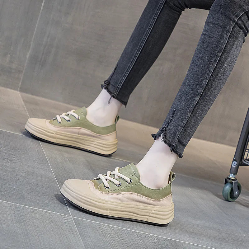 Women's matcha green leather platform sneakers with round toe and white laces on a flat sole.