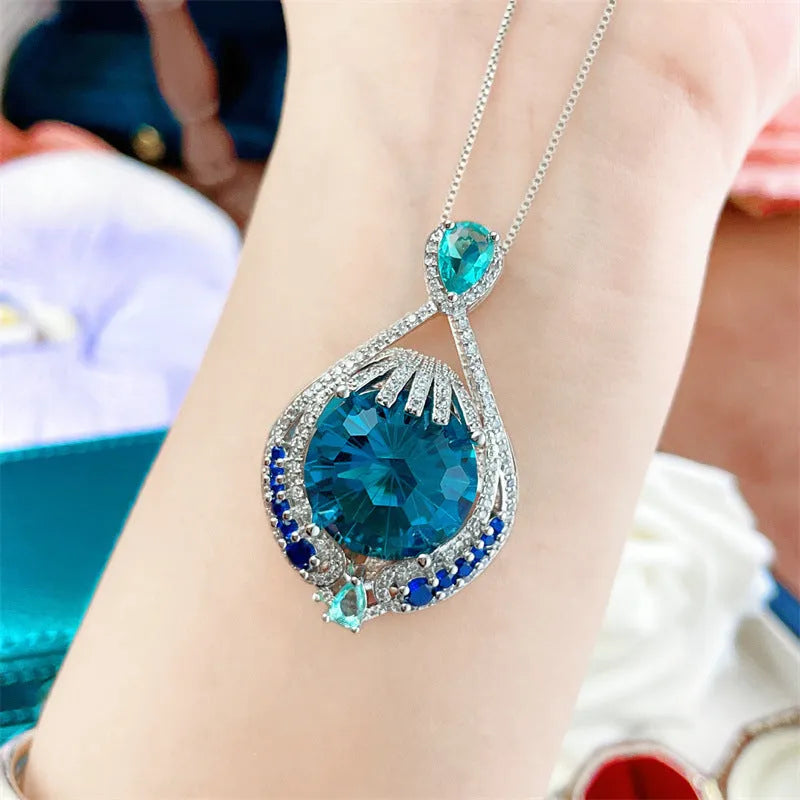Geometric pendant necklace with blue crystal and water wave chain for women