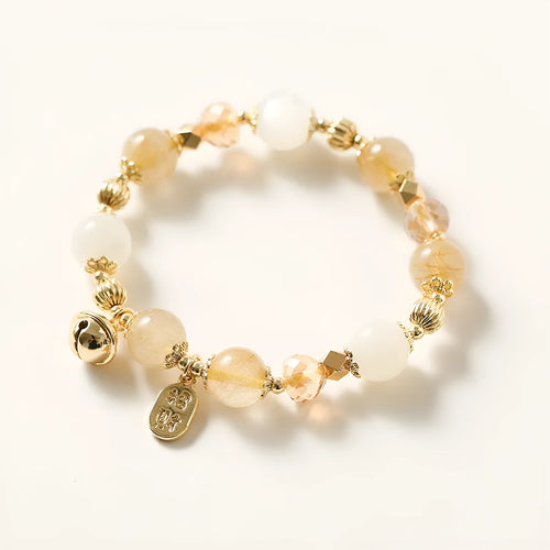 Gold electroplated bracelet featuring natural rutilated quartz crystals with golden rutile needle inclusions