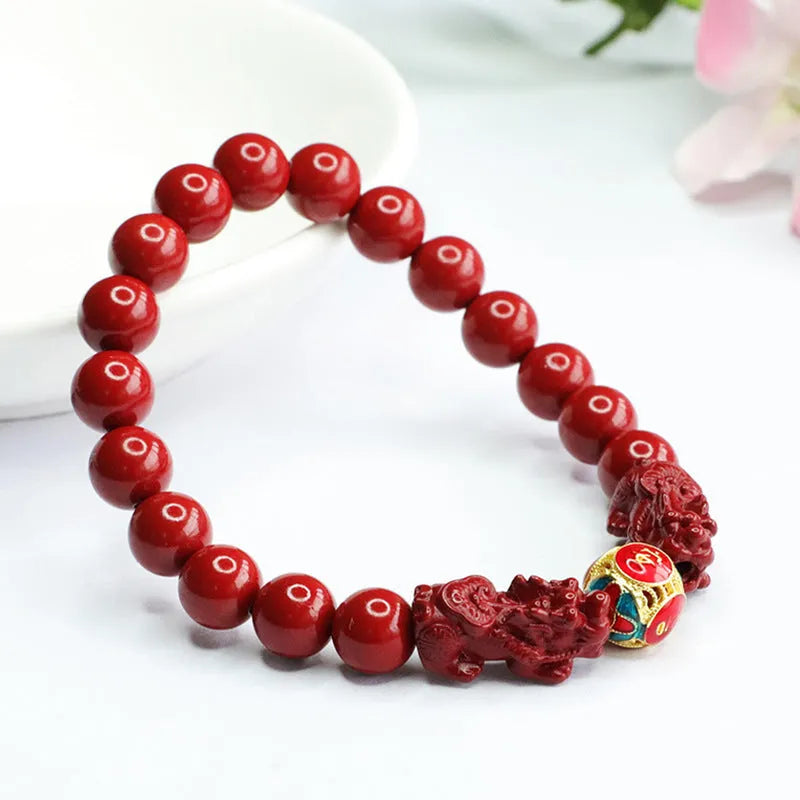Close-up of a purple gold sand carved cinnabar women's bracelet with a double Pixiu design.