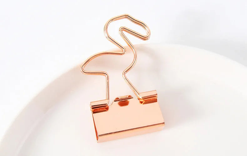 Gold long tail metal clip with a decorative flamingo, love, clouds, cat, cactus, or bow design top.