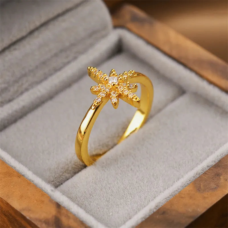 Gold geometric open adjustable ring for women on a white background.
