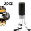 White and black automatic kitchen food stirrer with stainless steel whisk on countertop.