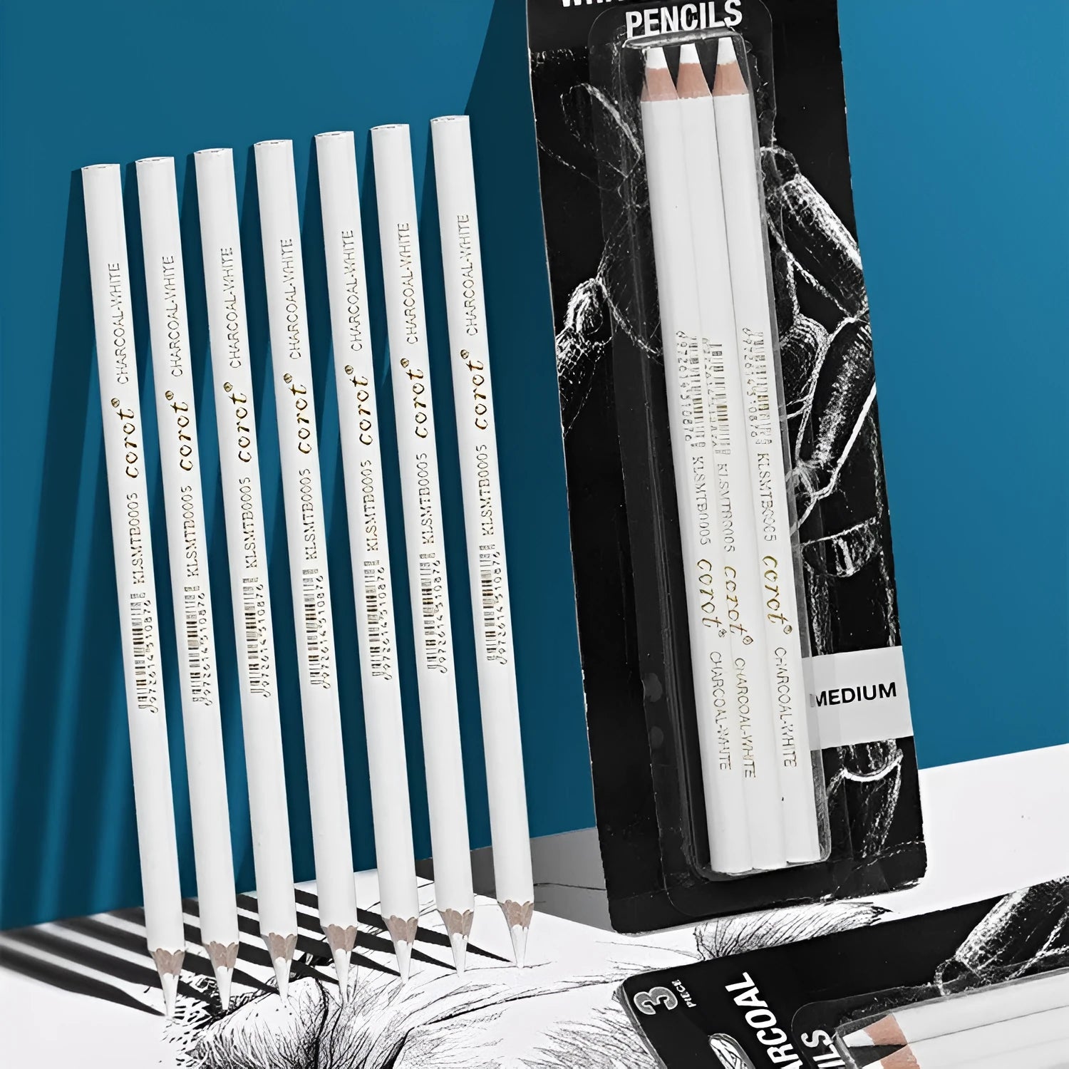 Set of three white charcoal highlighting pencils with wooden casings for sketching.