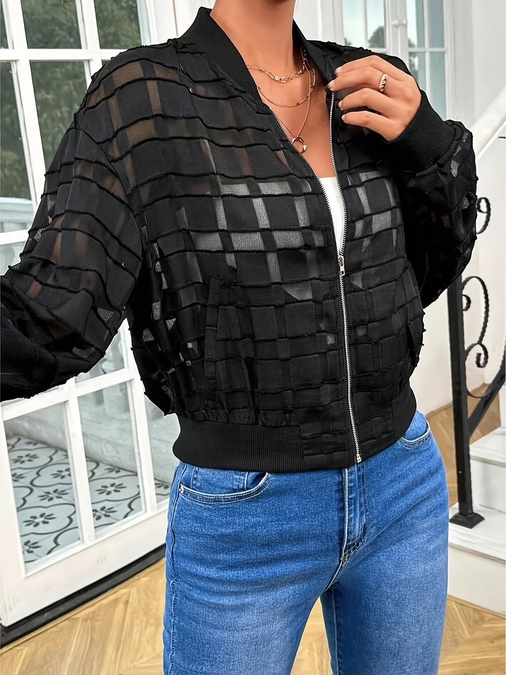 Black women's casual jacket with white geometric thread pattern and front zipper.