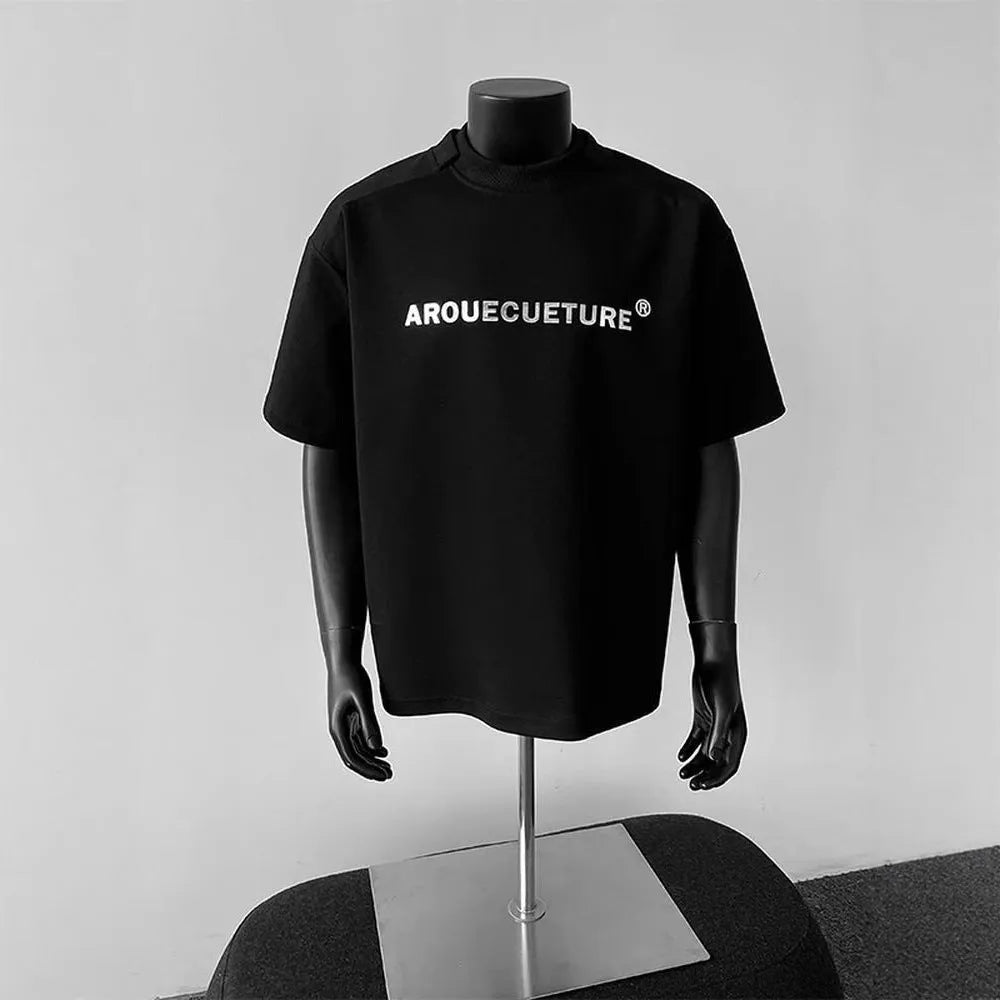 Men's loose short sleeve cotton t-shirt with printed letters in light grey.