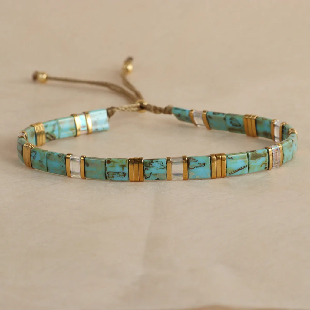 Geometric pull beads bracelet in glass or coloured glaze with round elements