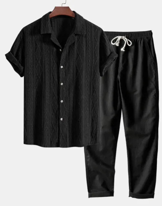 Lightweight linen-feel casual suit set with camouflage print trousers and a short-sleeved lapel shirt.