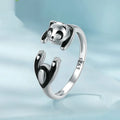 Cute Panda adjustable open ring in sterling silver with white gold plating on a finger.