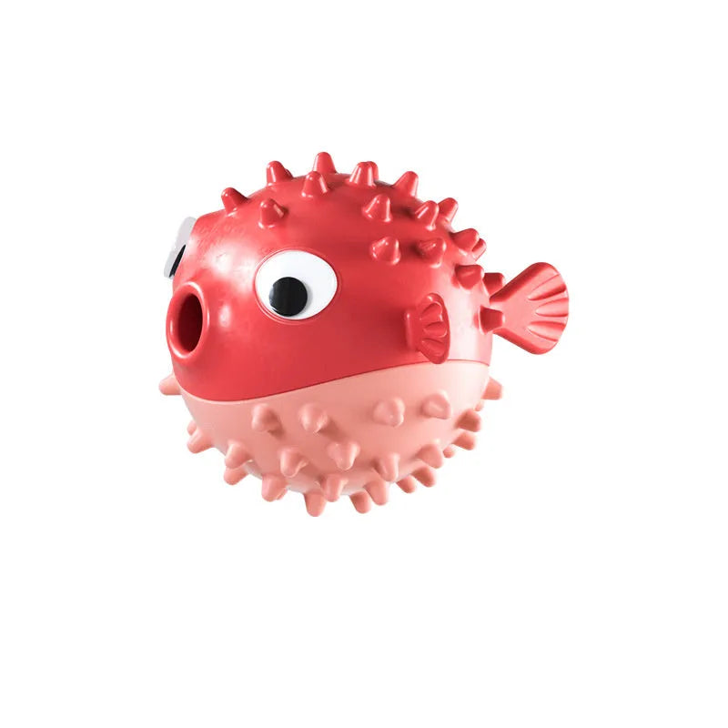 Green fish-shaped interactive dog chew toy with textured surface for treat dispensing
