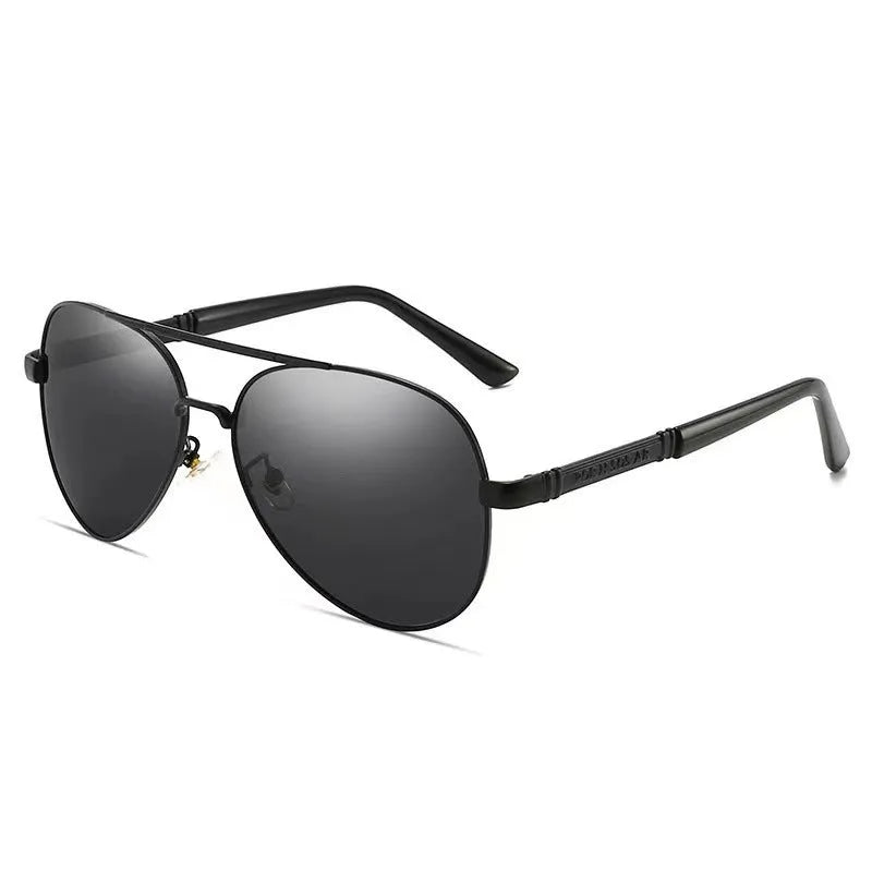 Gold metal frame polarised sunglasses with grey lenses on a table, showing dragon and phoenix temple detail.