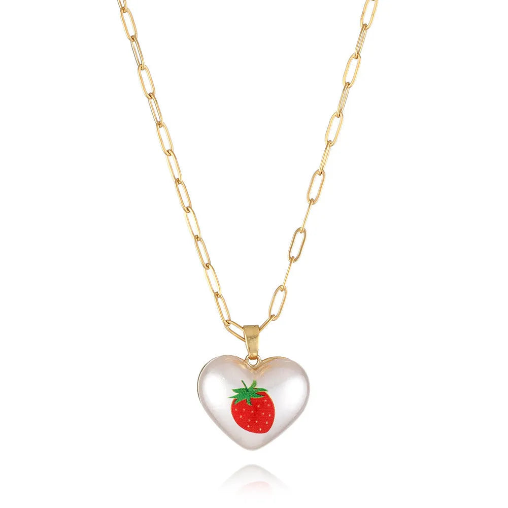 Heart-shaped necklace with fruit pendant on geometric chain showing strawberry pineapple apple pear cherry options