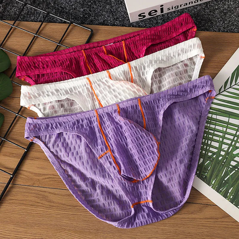 Men's low waist ice silk lace briefs in solid colours including rose red and light purple on a size chart.