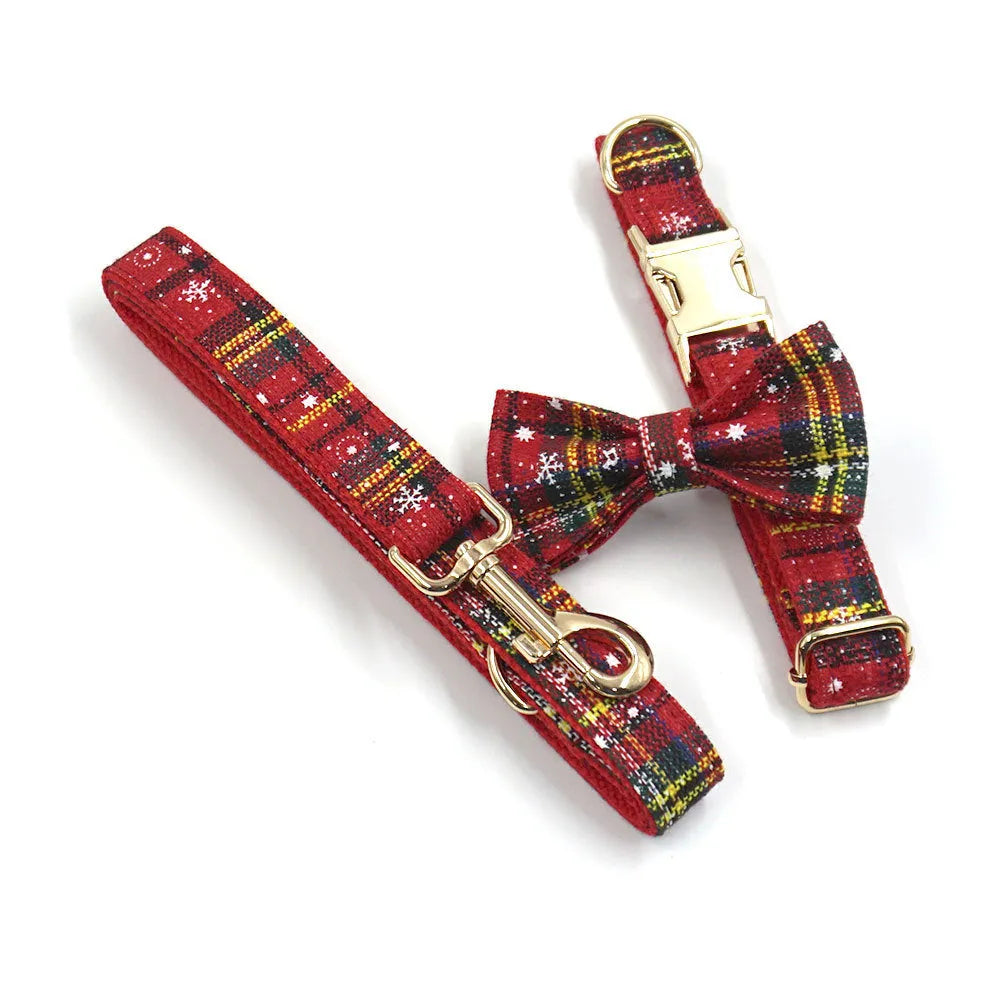 Red Christmas dog suit set with collar, leash, bow, and chest-back harness on a festive background.