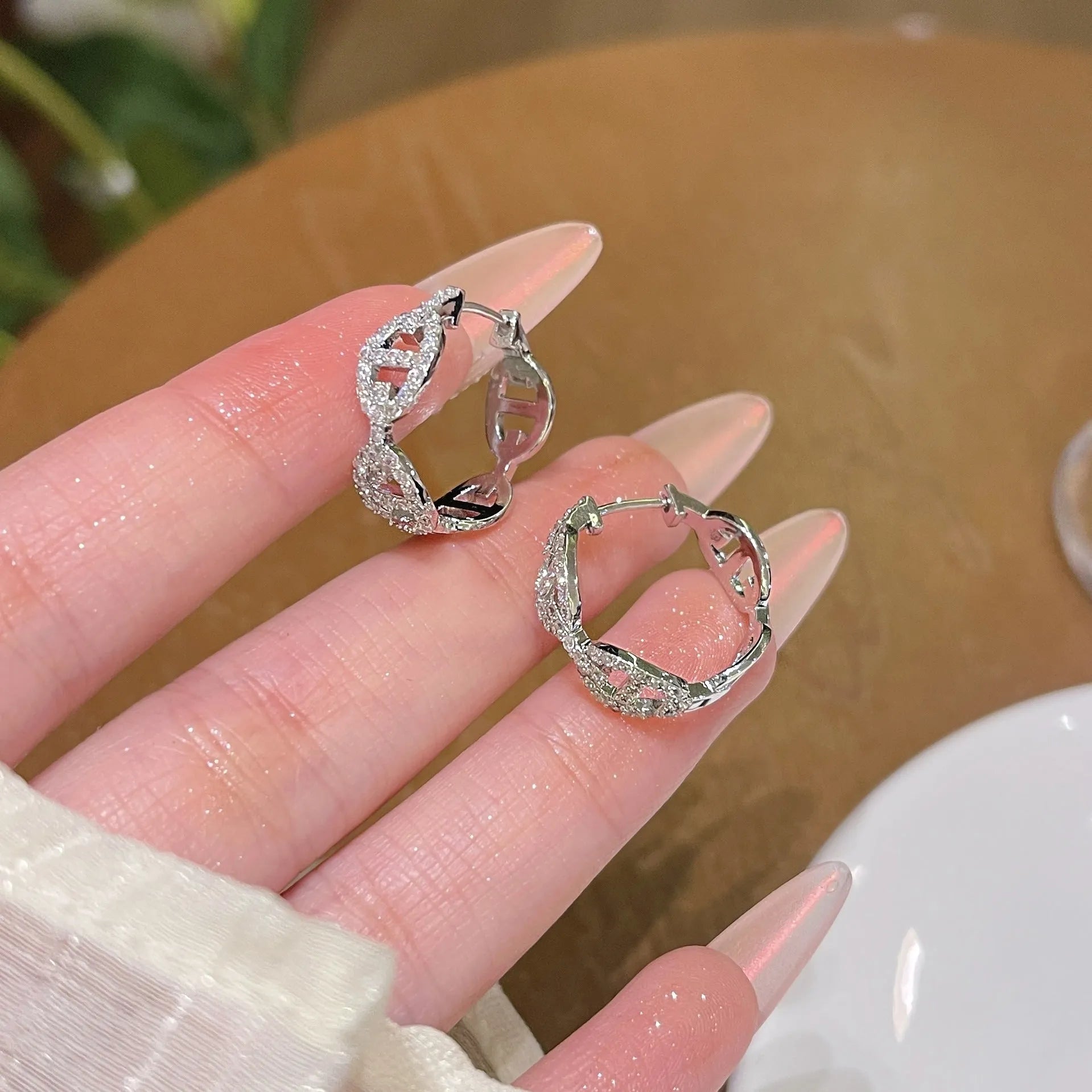 Ladies casual drop earrings with diamond design in silver, gold, or rose gold electroplated finish.