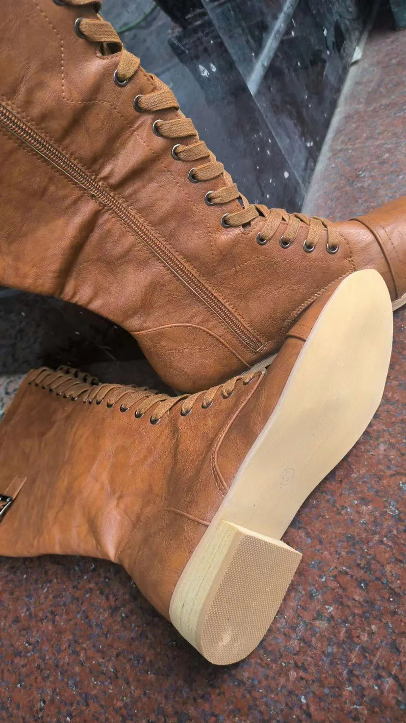Women's black knight ankle boots with a cross strap detail over the front, made from artificial PU.